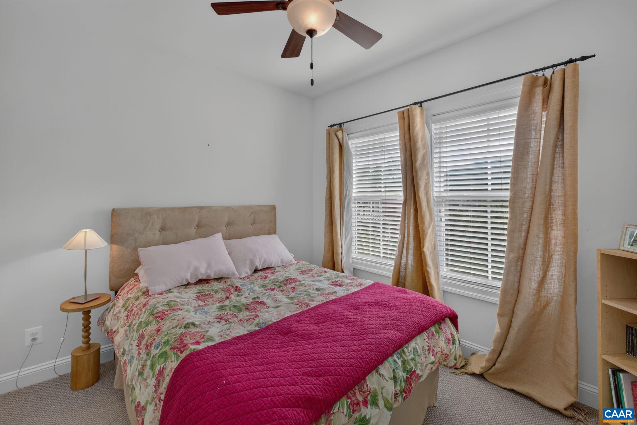 One of two additional third level bedrooms with ceiling fan. One of two additional third level bedrooms with ceiling fan.