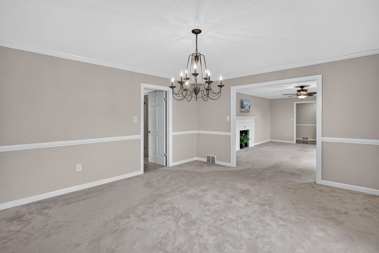 The Living Room opens to Dining Room and the Dining Room adjoins the Kitchen