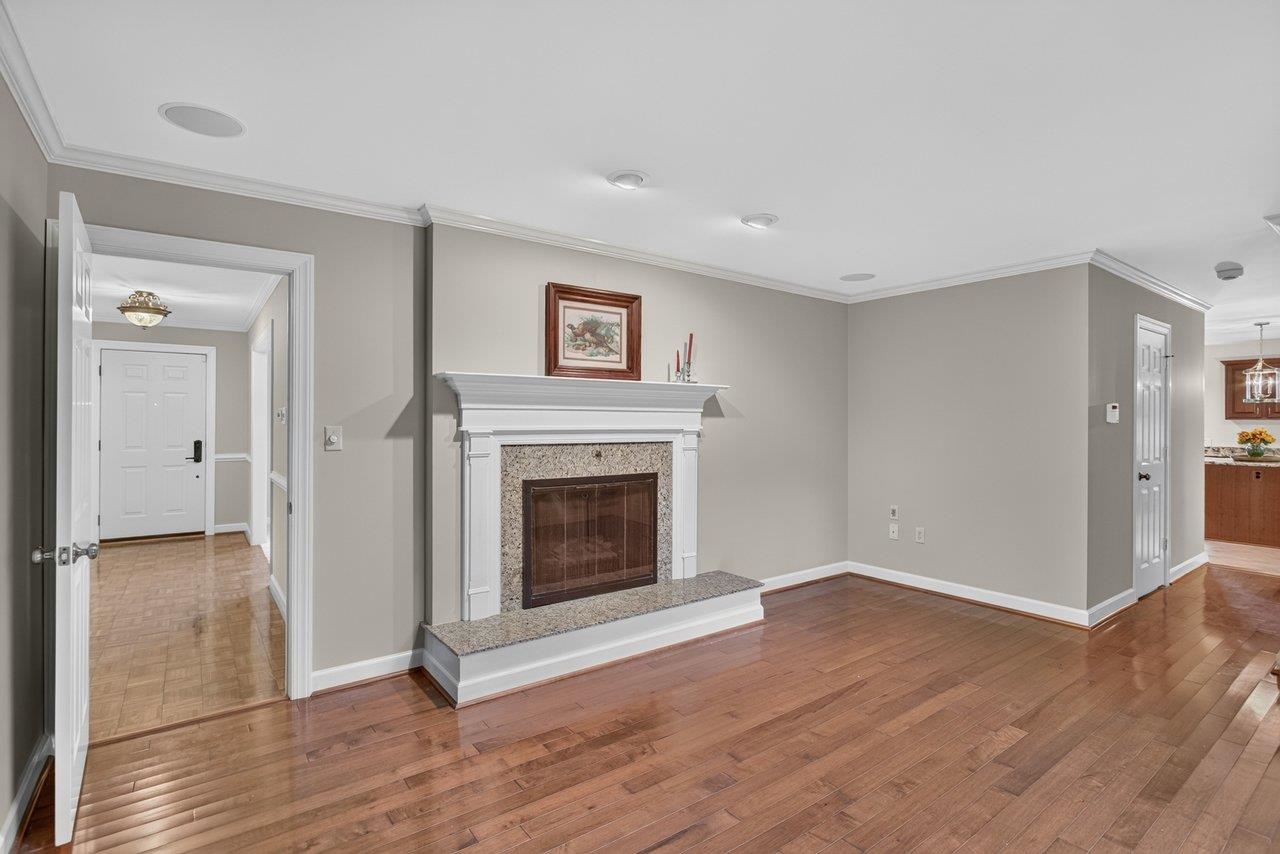 This cozy room looks out over the private backyard. The fireplace is woodburning, and room is wired for overhead audio speakers