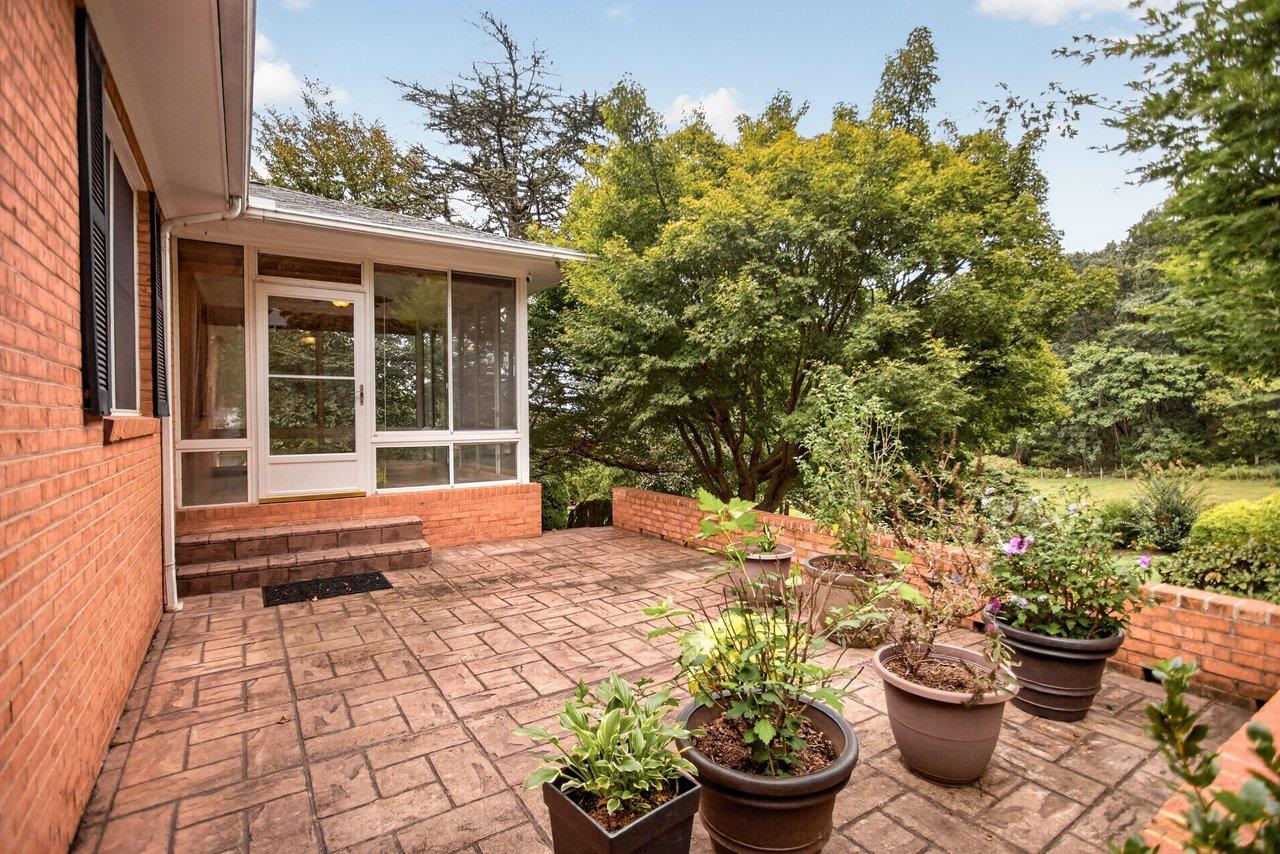 Step out of the Sunroom and onto the patio where there is plenty of room for cookouts.
