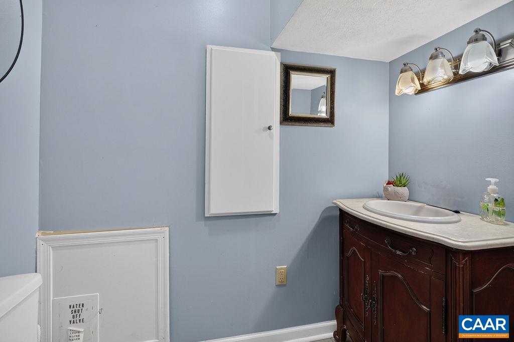 Half bathroom off of one of the bedrooms Half bathroom off of one of the bedrooms