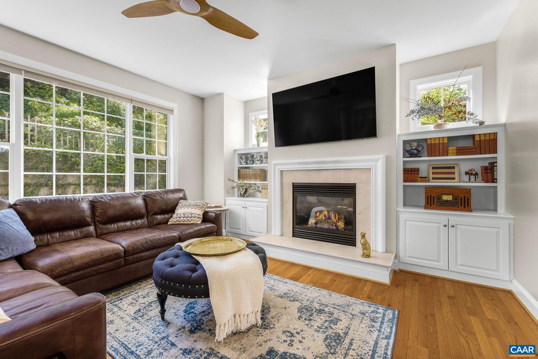 Family room, gas fireplace, natural light, and built in shelves. Family room, gas fireplace, natural light, and built in shelves.