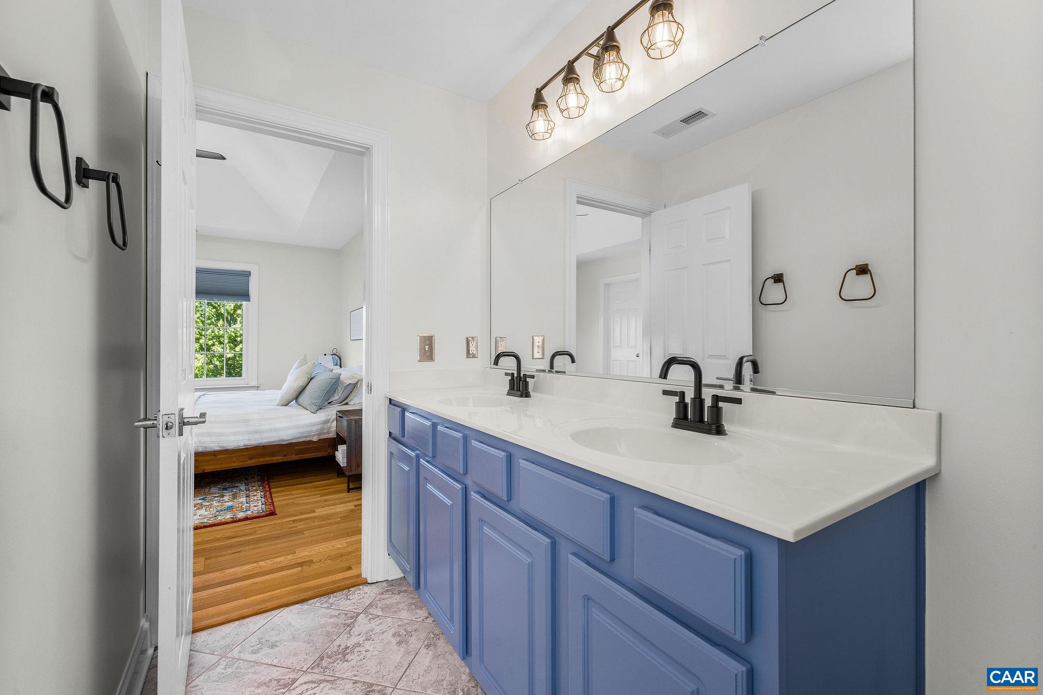 En suite with his-and-hers vanity, walk-in shower, soaking tub, and separate toilet. En suite with his-and-hers vanity, walk-in shower, soaking tub, and separate toilet.