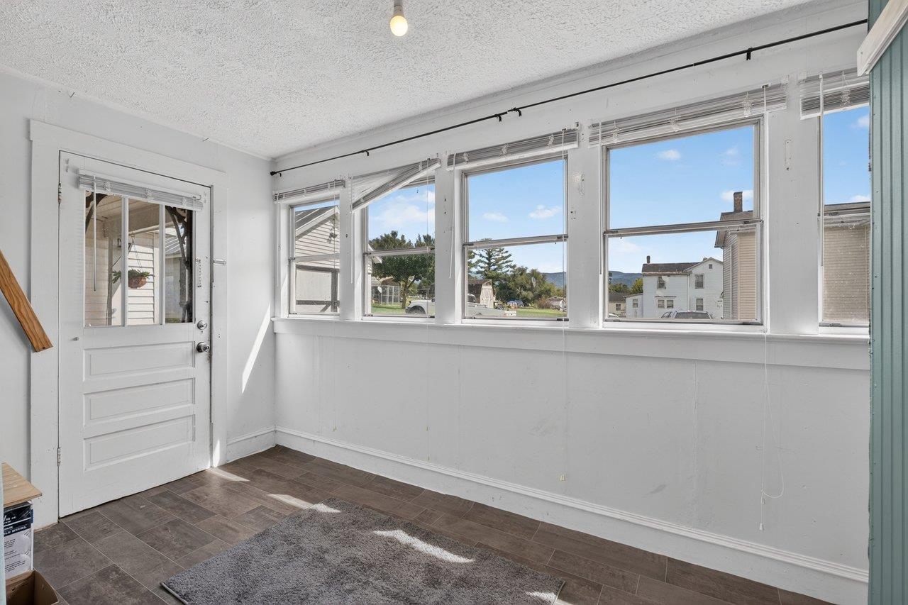 Versatile enclosed side porch with many possibilities. Versatile enclosed side porch with many possibilities.