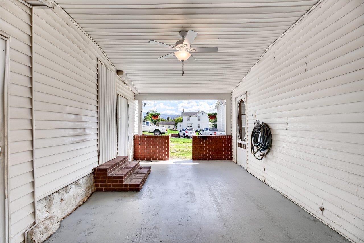 Covered back porch with access to several storage rooms adds to the home's abundant storage space. Covered back porch with access to several storage rooms adds to the home's abundant storage space.
