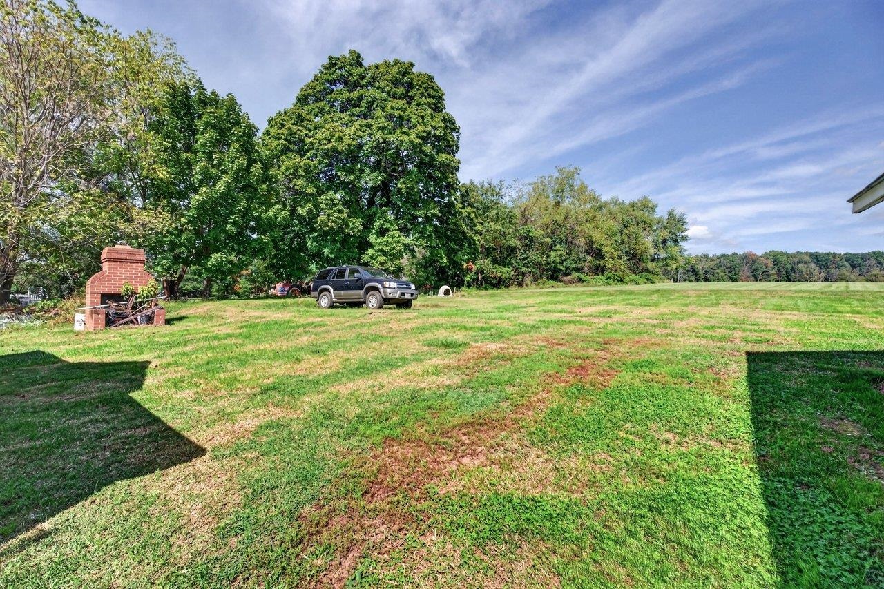 The private backyard offers plenty of space with no homes directly behind you. Enjoy gardening, relaxing around the brick fireplace, or spending time outdoors with family, children, or pets. A great space for enjoying the outdoors! The private backyard offers plenty of space with no homes directly behind you. Enjoy gardening, relaxing around the brick fireplace, or spending time outdoors with family, children, or pets. A great space for enjoying the outdoors!