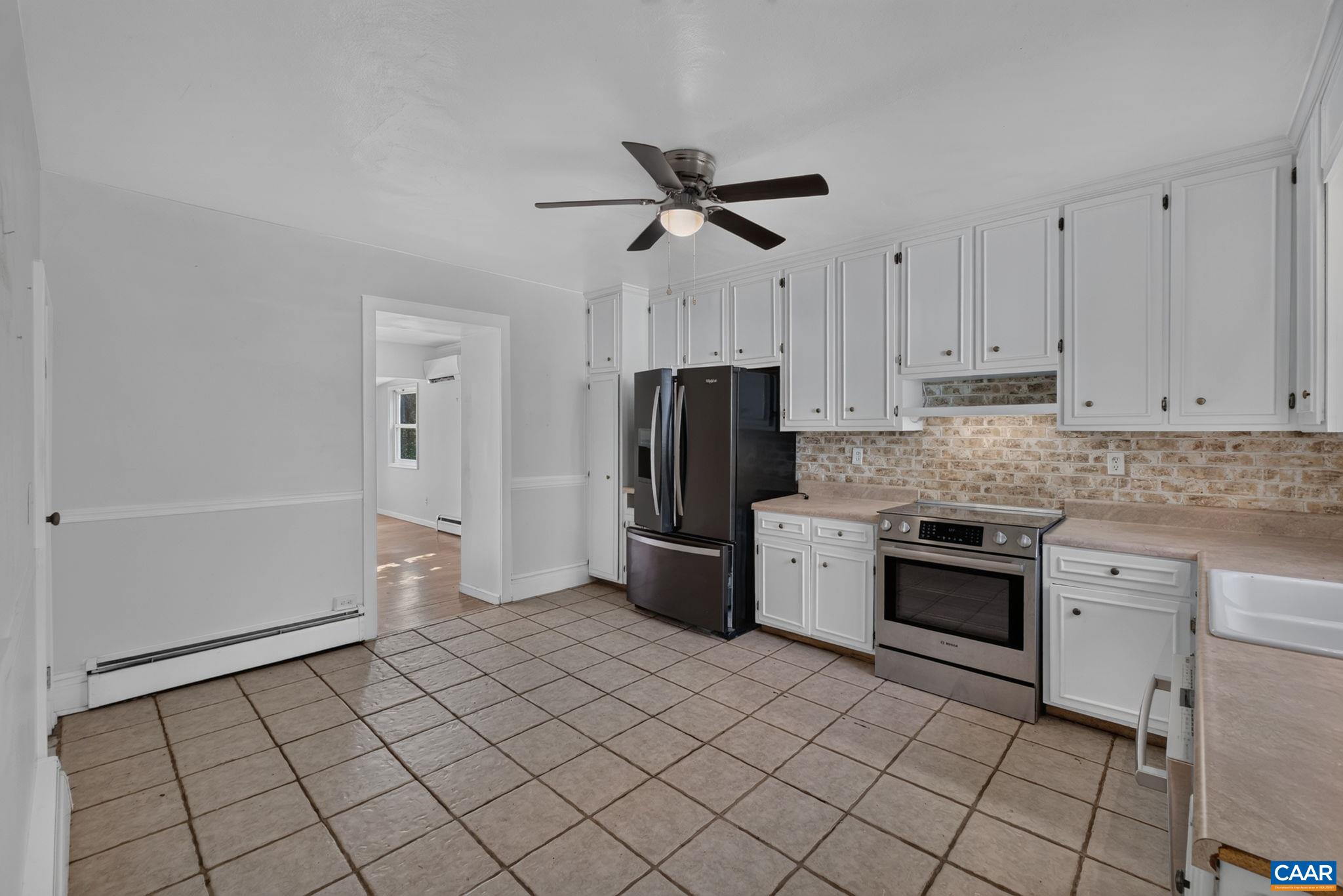 Kitchen with door to the family room. Kitchen with door to the family room.