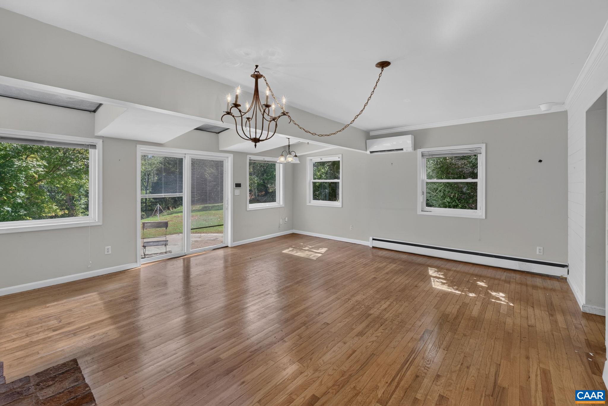 Family room with slider to the backyard. Beautiful hardwood floors abound. Family room with slider to the backyard. Beautiful hardwood floors abound.