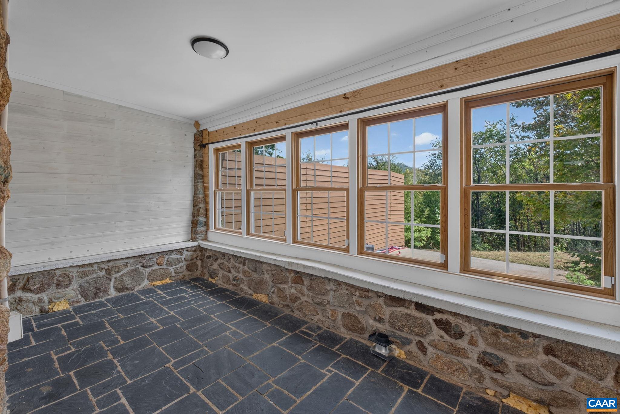 Enclosed back porch. Enclosed back porch.