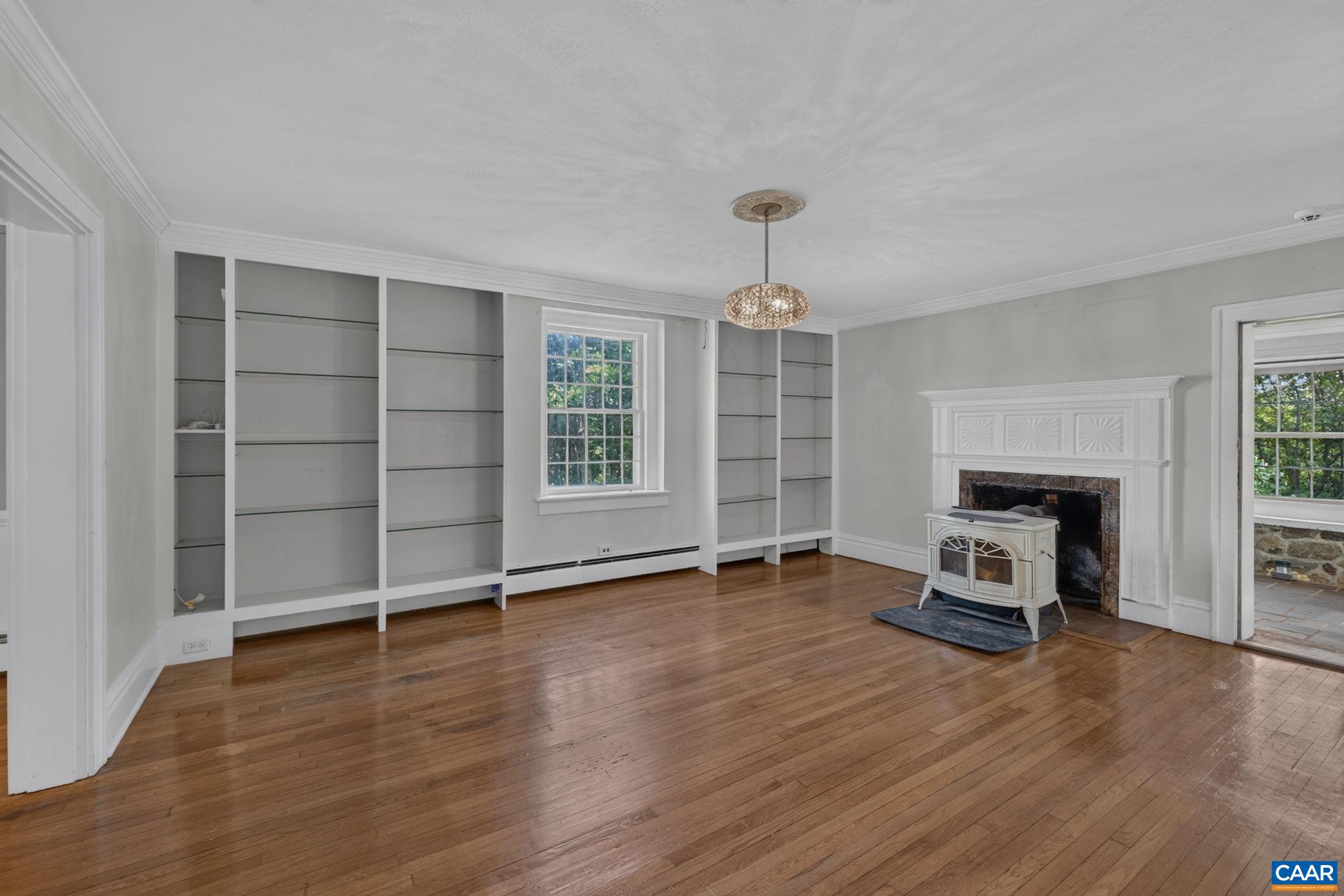 Living room with wood stove and built-ins. Living room with wood stove and built-ins.