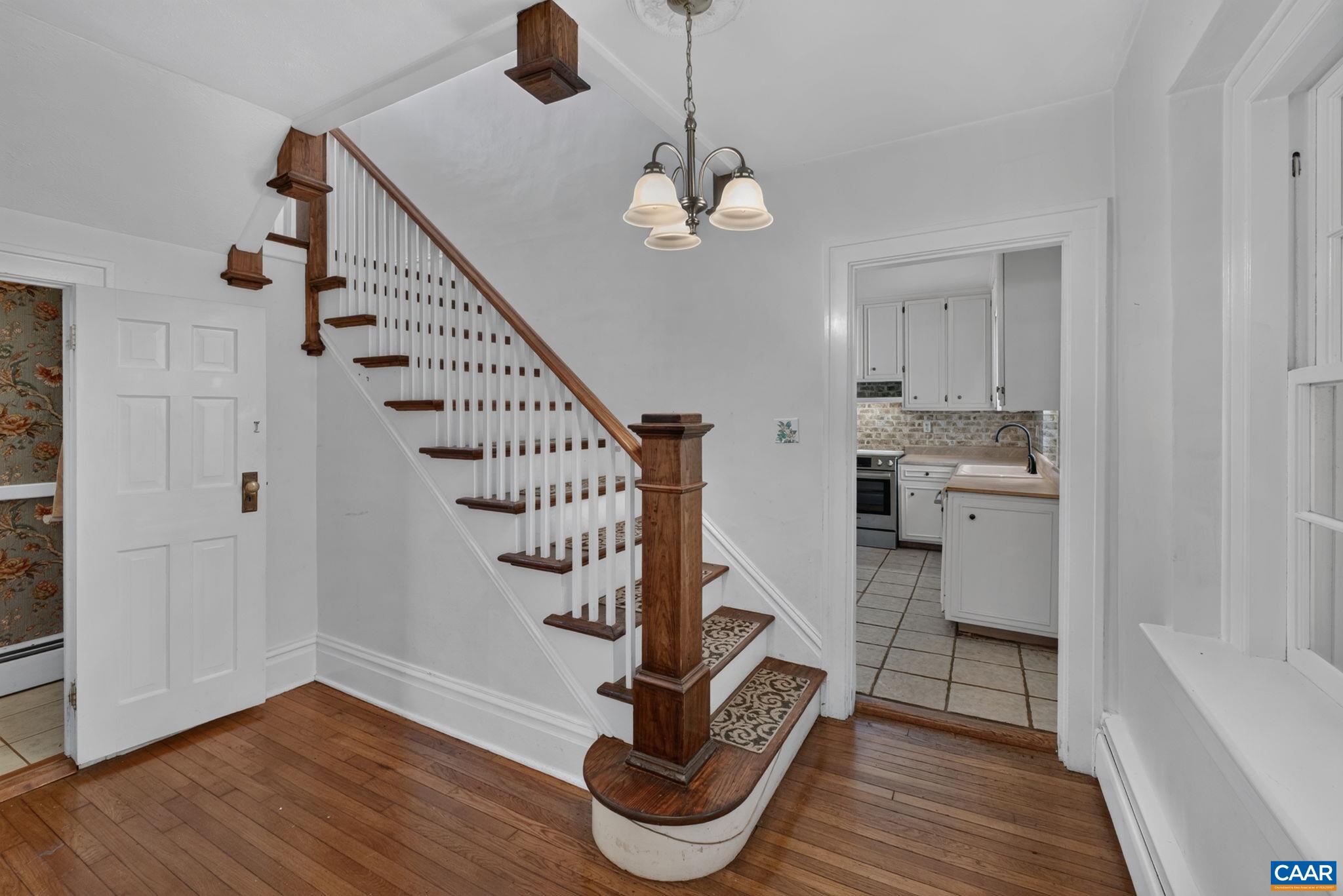 Beautiful wood stairway leading upstairs. Beautiful wood stairway leading upstairs.