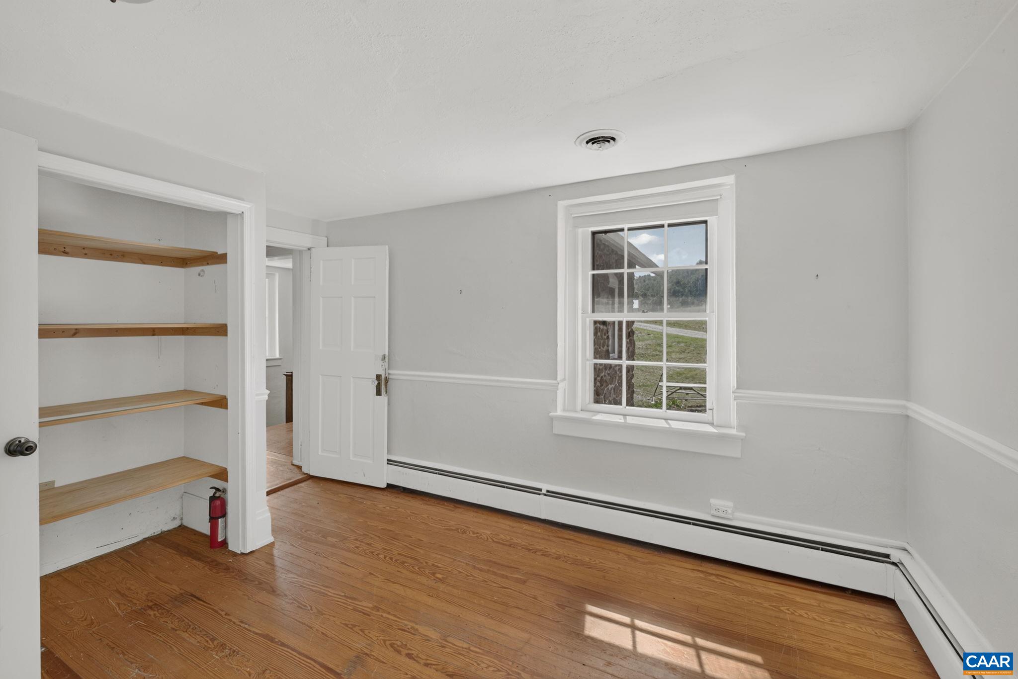 Additional upstairs bedroom with built-ins. Additional upstairs bedroom with built-ins.