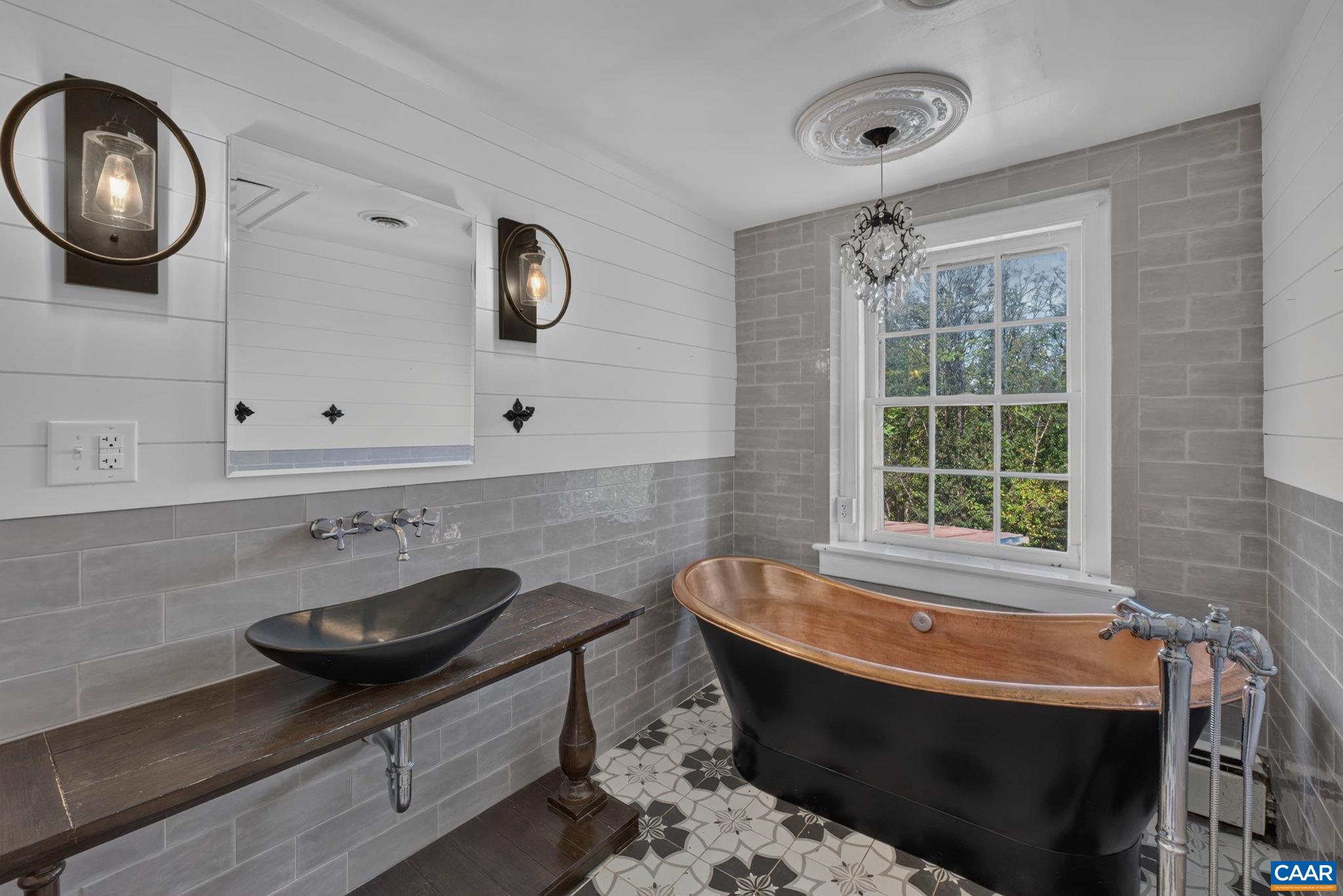 Upstairs hall bathroom with copper tub. Upstairs hall bathroom with copper tub.