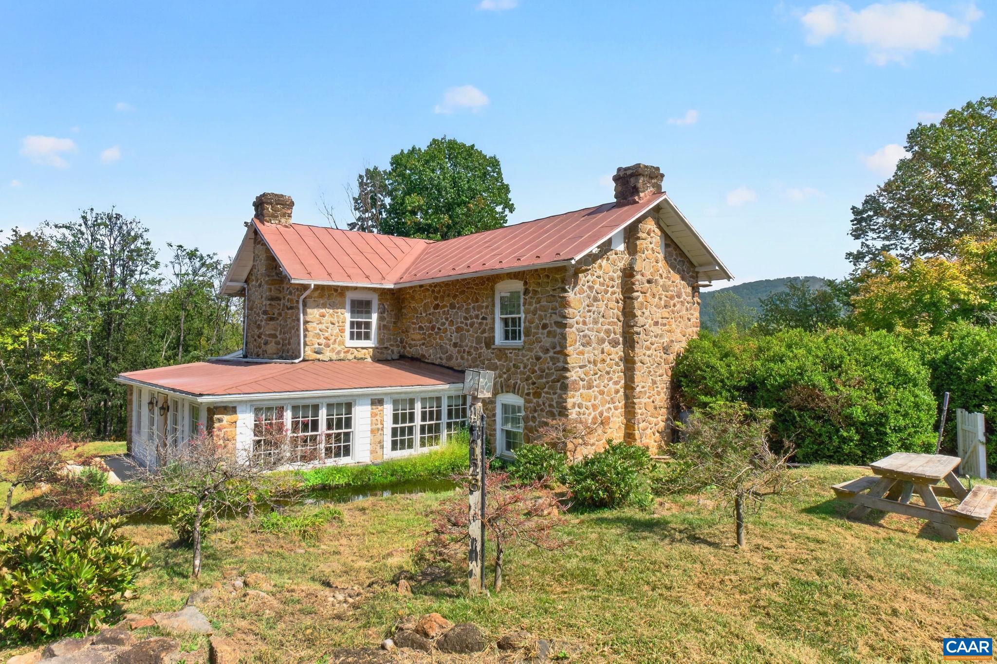 Side of home with lower water feature. Side of home with lower water feature.