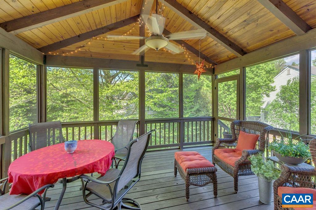 Wonderful screen porch with soaring ceiling feels like being in a treehouse!