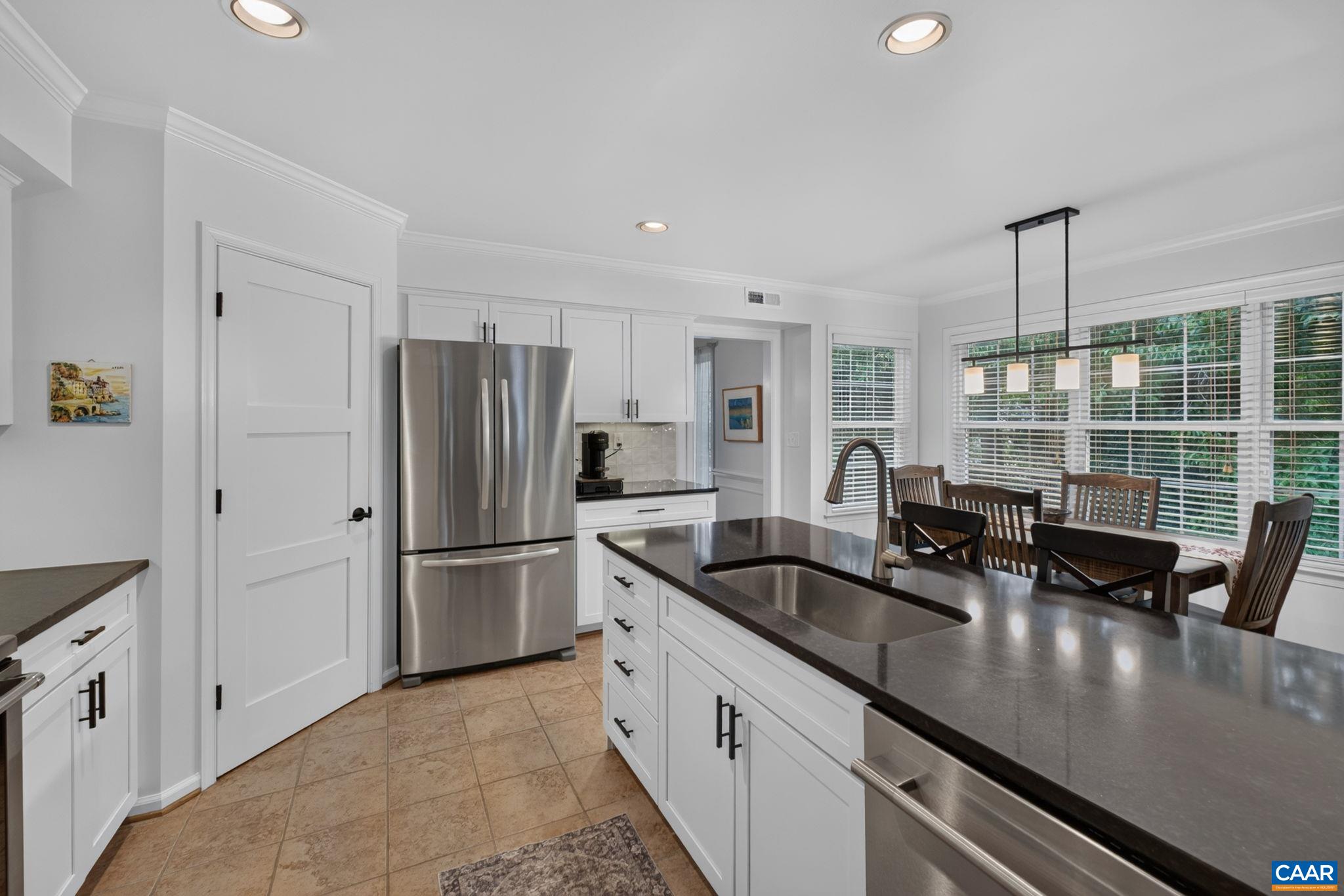 Stainless appliances including a new dishwasher and microwave.