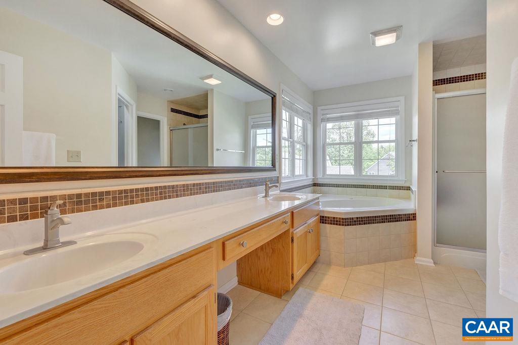 Tiled primary bathroom.
