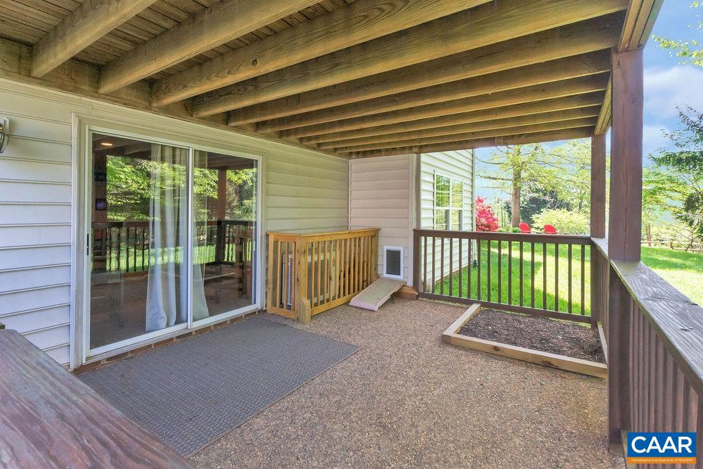 Small area under the screen porch is fenced and has a pet door leading to the storage room.