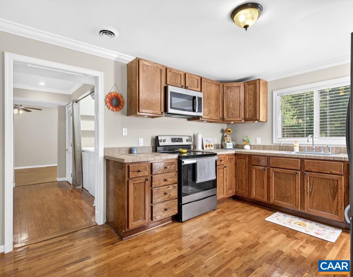 Kitchen with view into dining/room