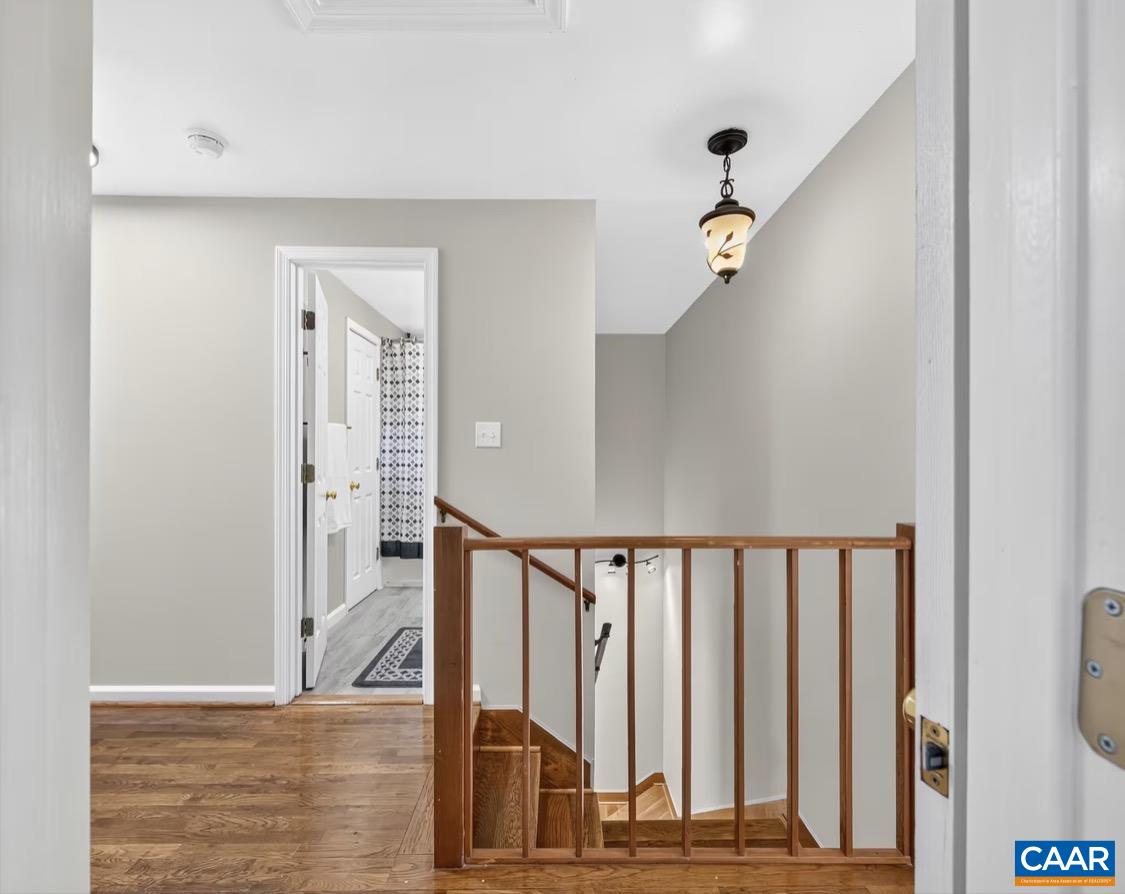 2nd floor landing looking downstairs and 2nd bathroom