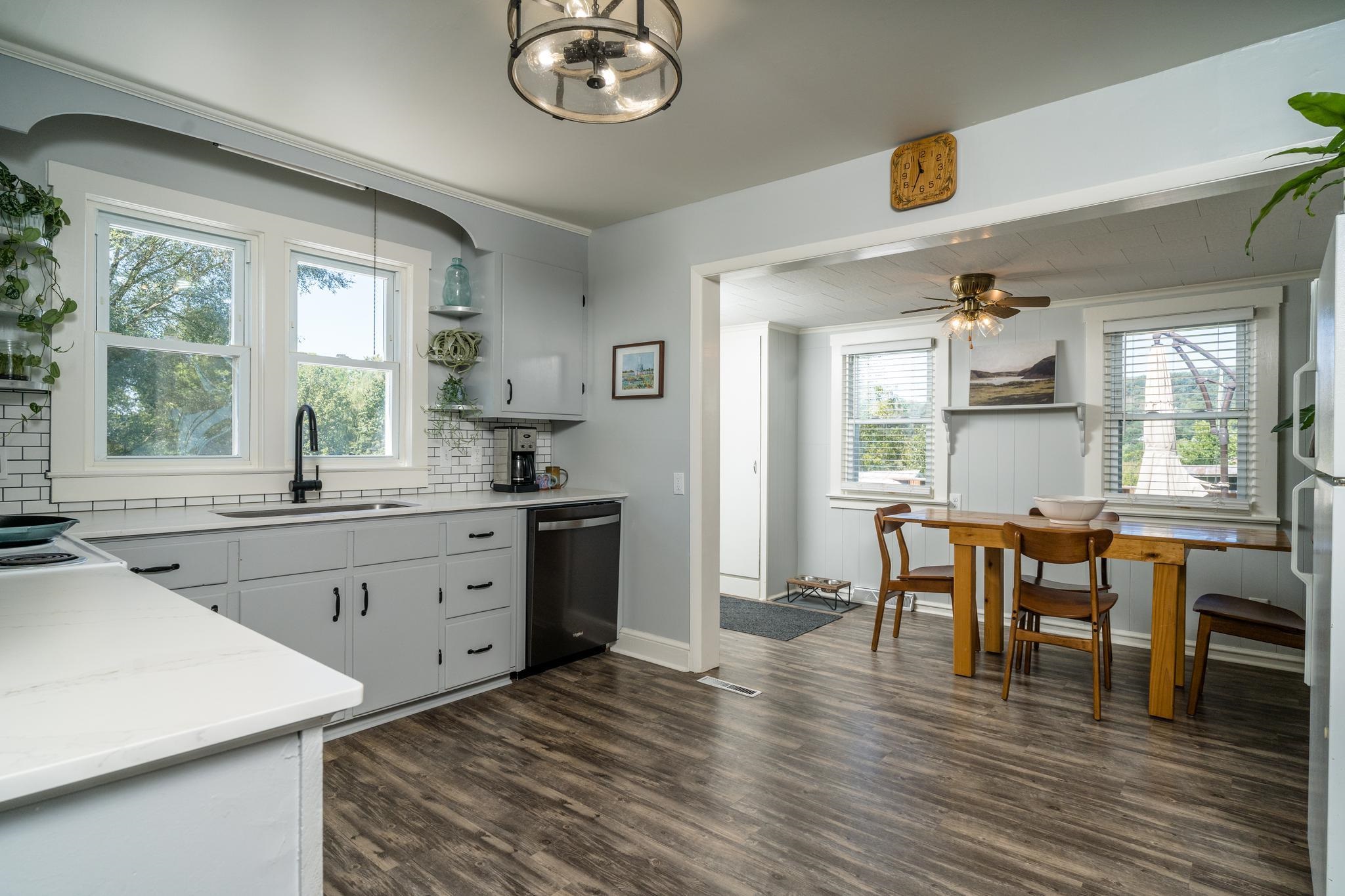 showing dining area and entrance to back door.