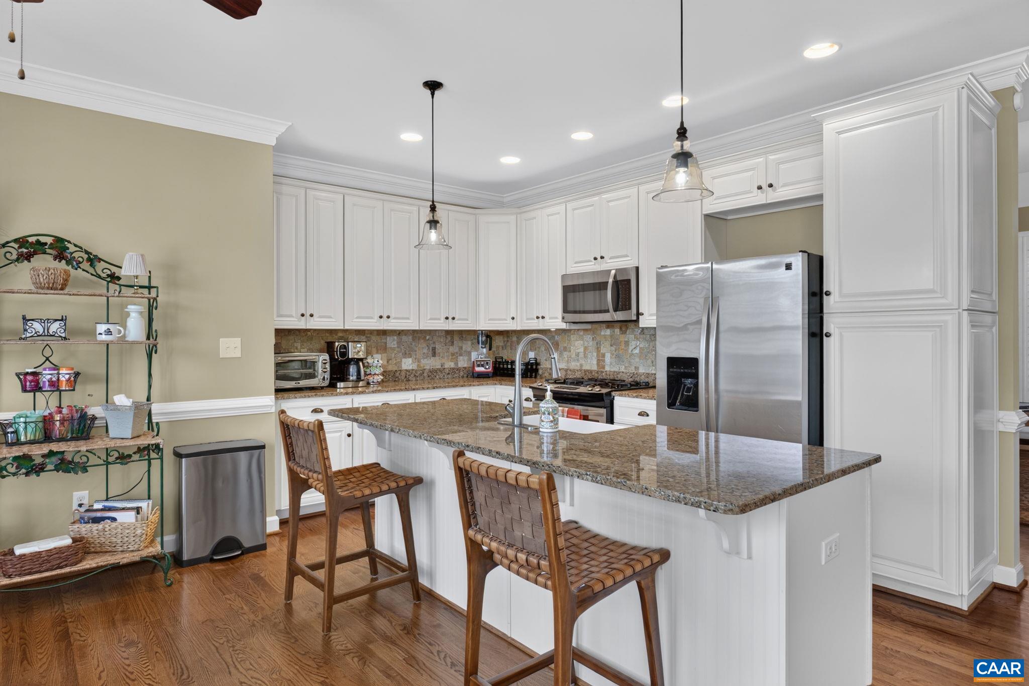 The kitchen island is open to the great room, allowing for easy entertaining flow. The kitchen island is open to the great room, allowing for easy entertaining flow.