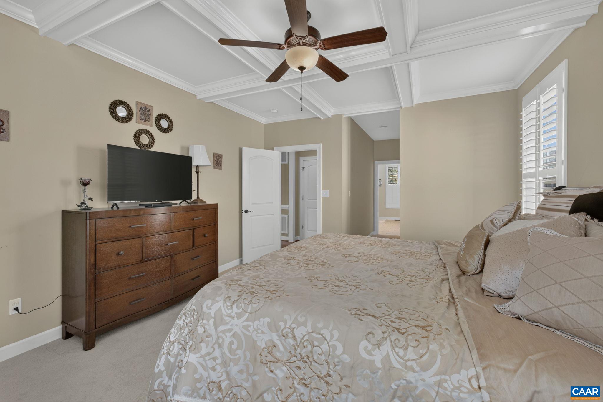 Walk-in closet and large primary bathroom Walk-in closet and large primary bathroom