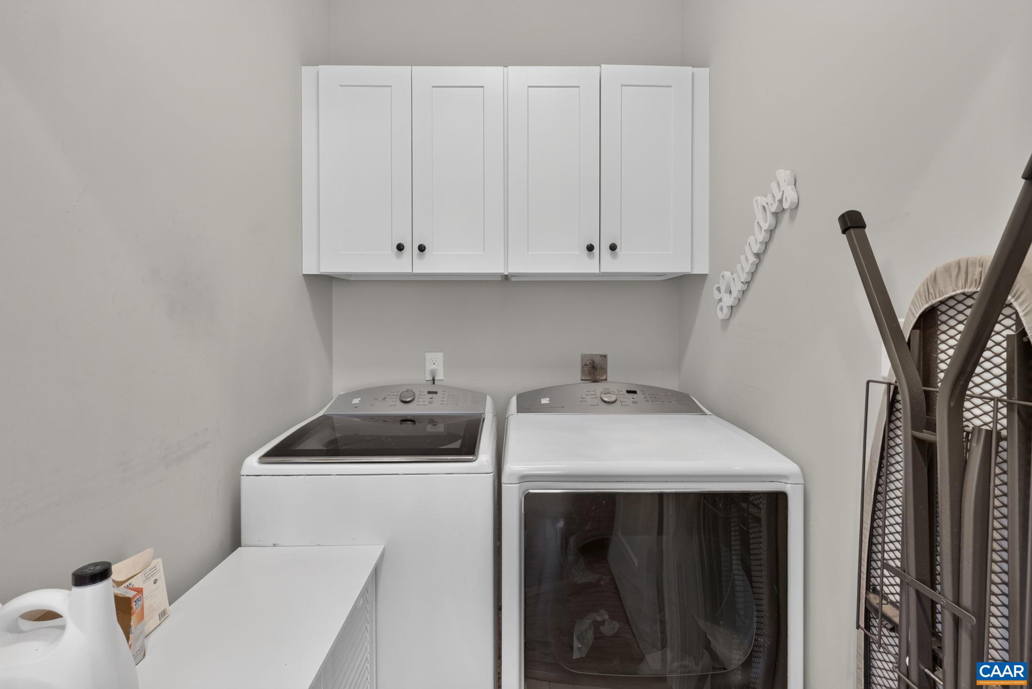 Laundry area with washer and dryer. Laundry area with washer and dryer.