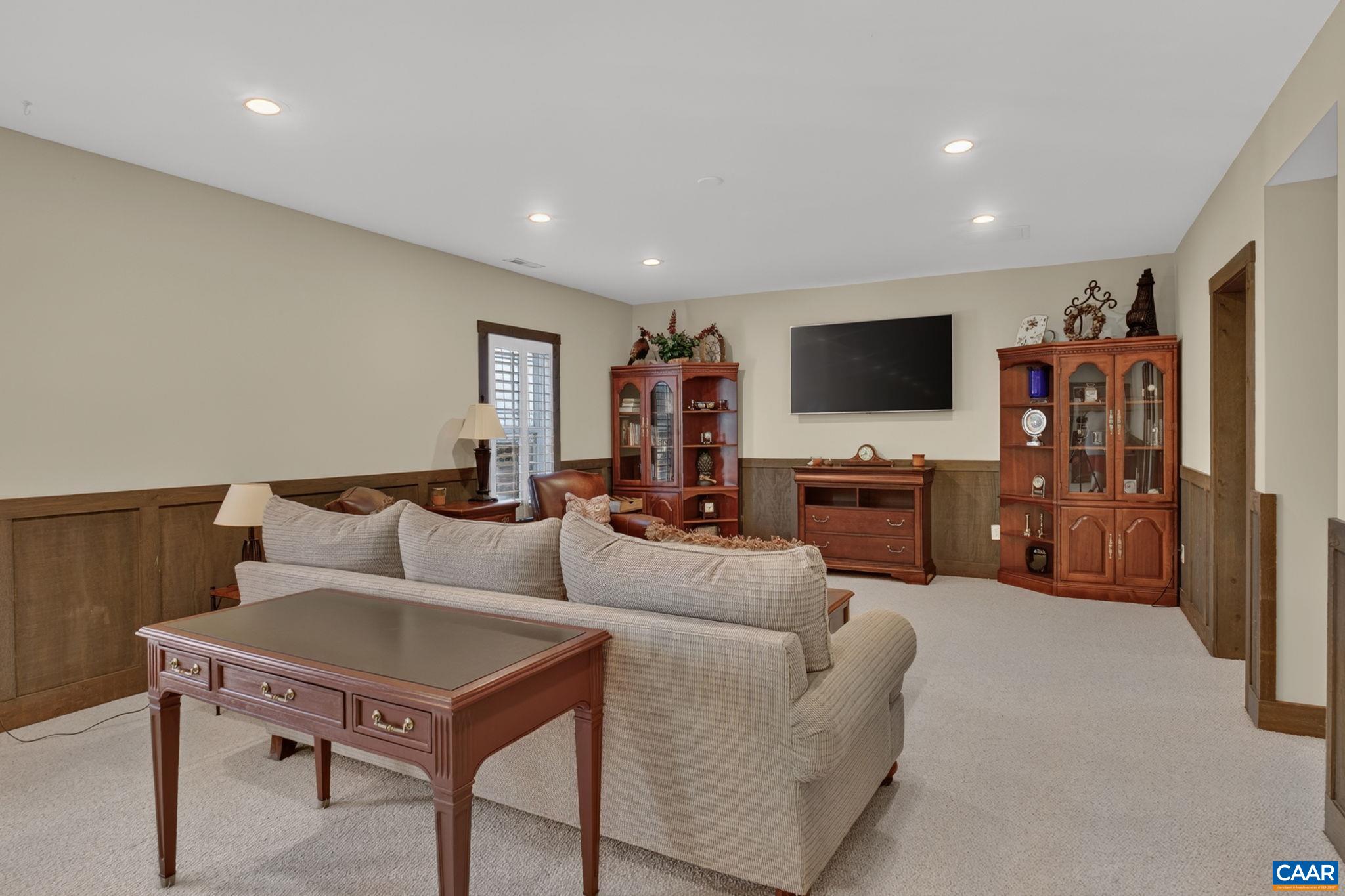 Generous terrace-level all-purpose room that can accommodate several individual living spaces! Generous terrace-level all-purpose room that can accommodate several individual living spaces!