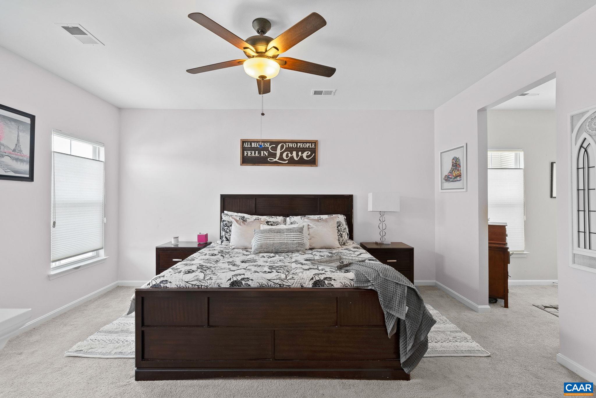 This primary bedroom will not disappoint. California king in place and plenty of room to walk around This primary bedroom will not disappoint. California king in place and plenty of room to walk around