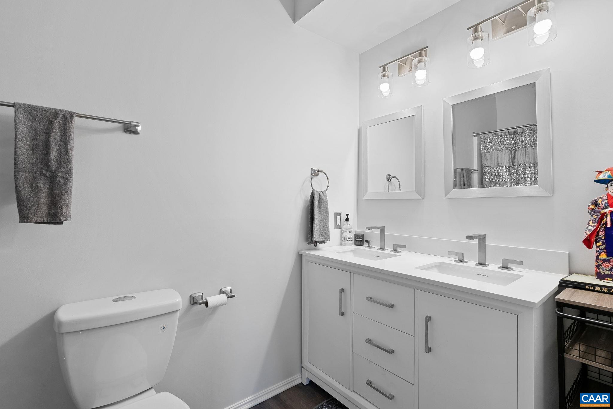 Full bathroom in basement with double sinks. Great for when the guests stay over Full bathroom in basement with double sinks. Great for when the guests stay over