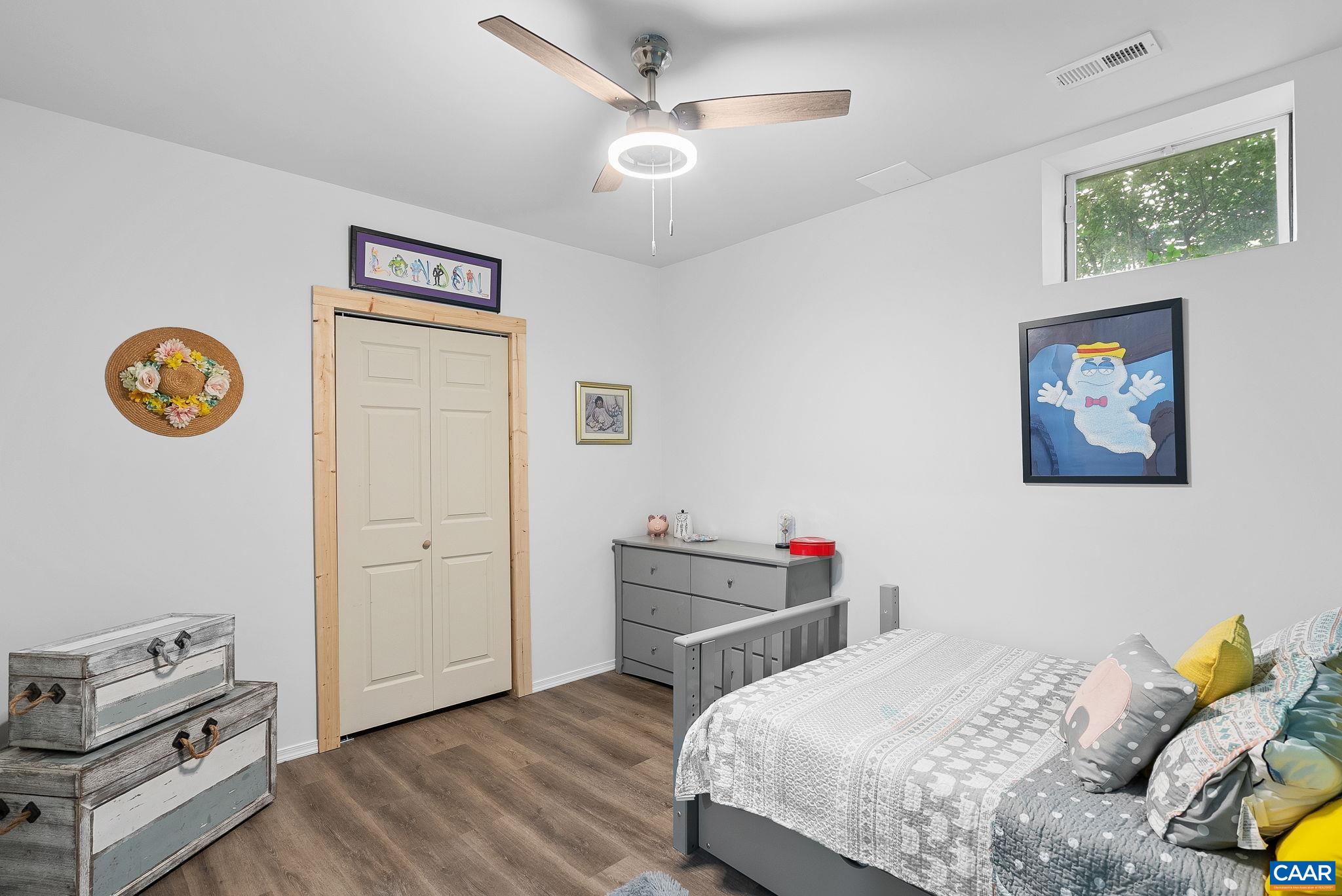 Although currently being used as a bedroom. Let your imagination create your desired room space in this sunlit room with closet and ceiling fan Although currently being used as a bedroom. Let your imagination create your desired room space in this sunlit room with closet and ceiling fan