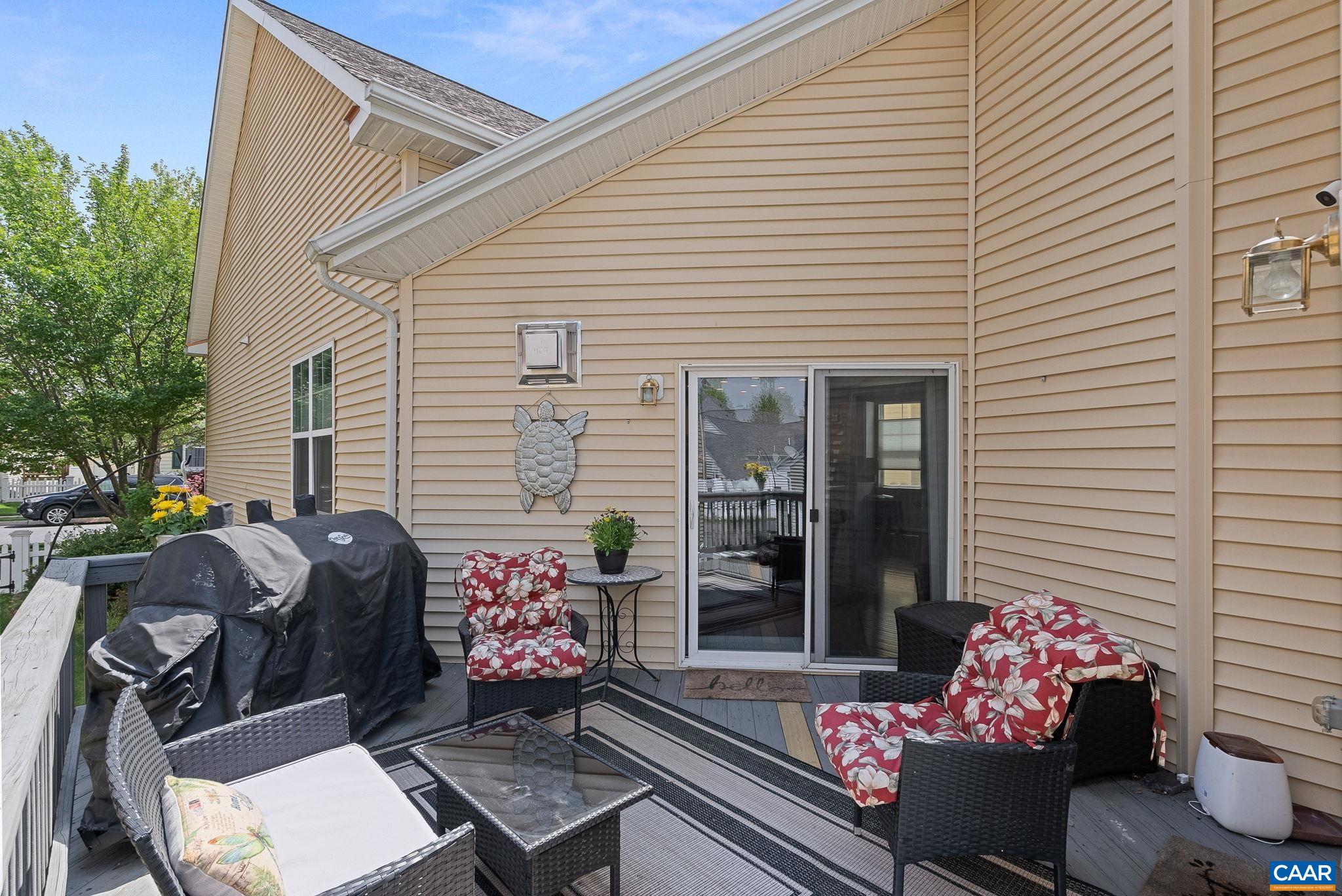 This main level deck has access from the living room as well as the primary suite. This main level deck has access from the living room as well as the primary suite.