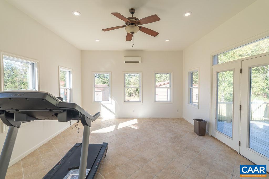 Sunroom located off of the family room at the rear of the house.