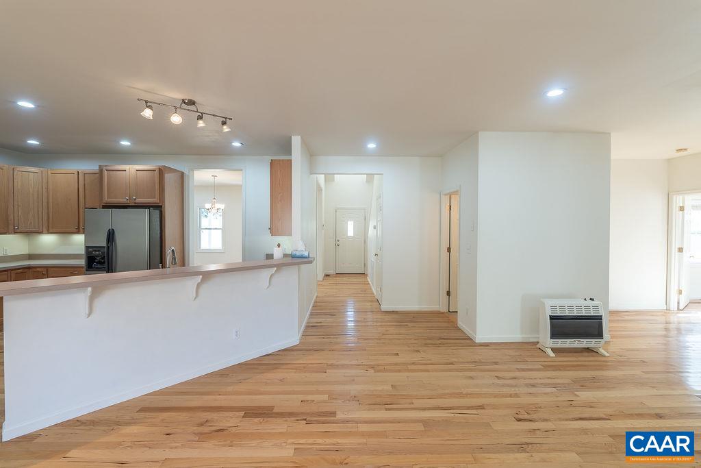 Spacious living area on the rear of the home with an open kitchen, eat-in area and large family room.