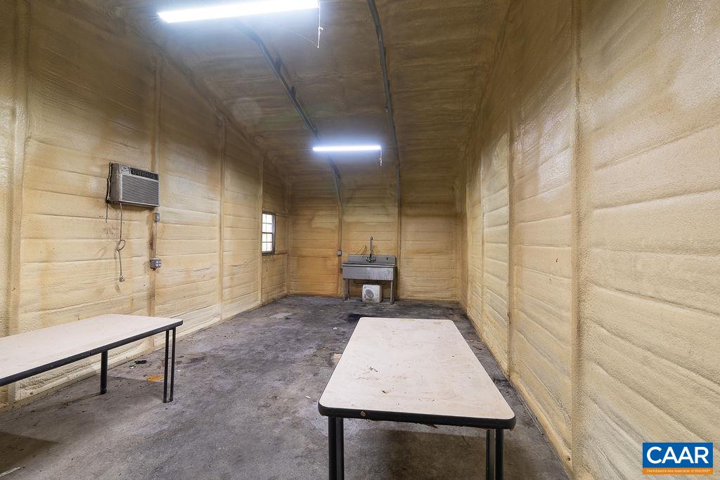 The back portion of the large garage is insulated and has a large sink.