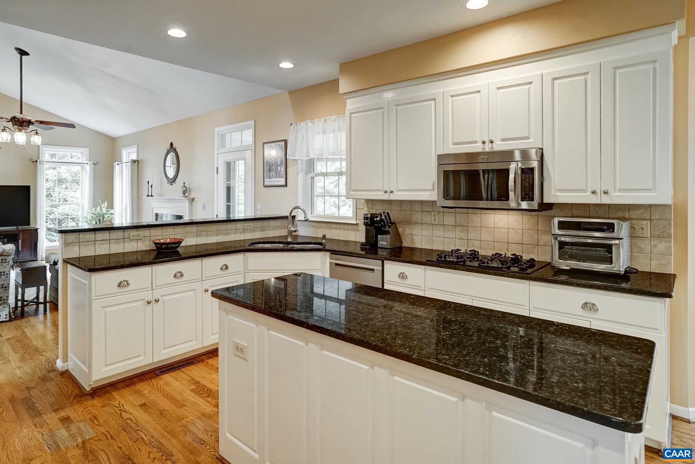 Kitchen with White Cabinets & Stainless Steel Appliances Kitchen with White Cabinets & Stainless Steel Appliances
