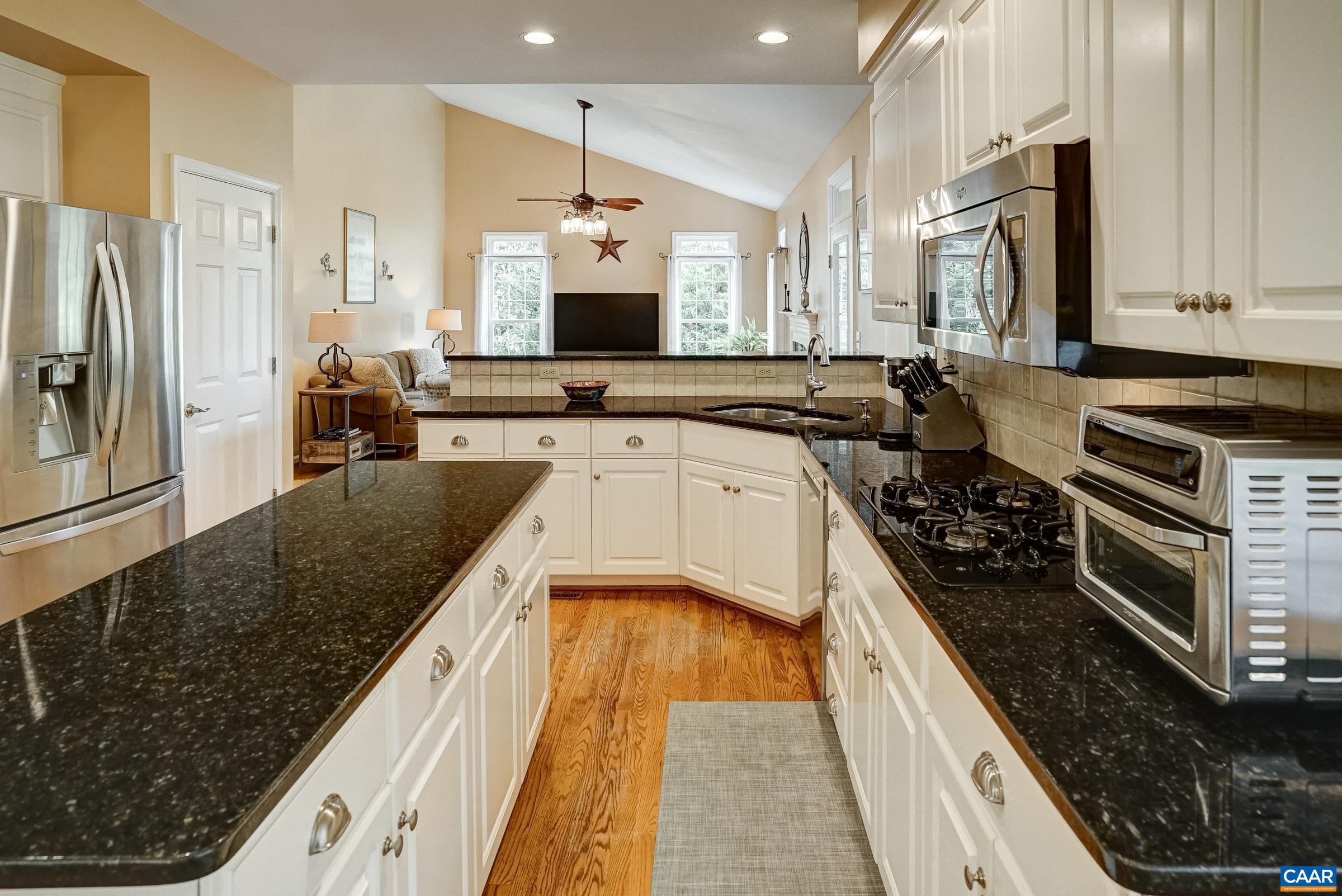 Kitchen with hardwood floors Kitchen with hardwood floors
