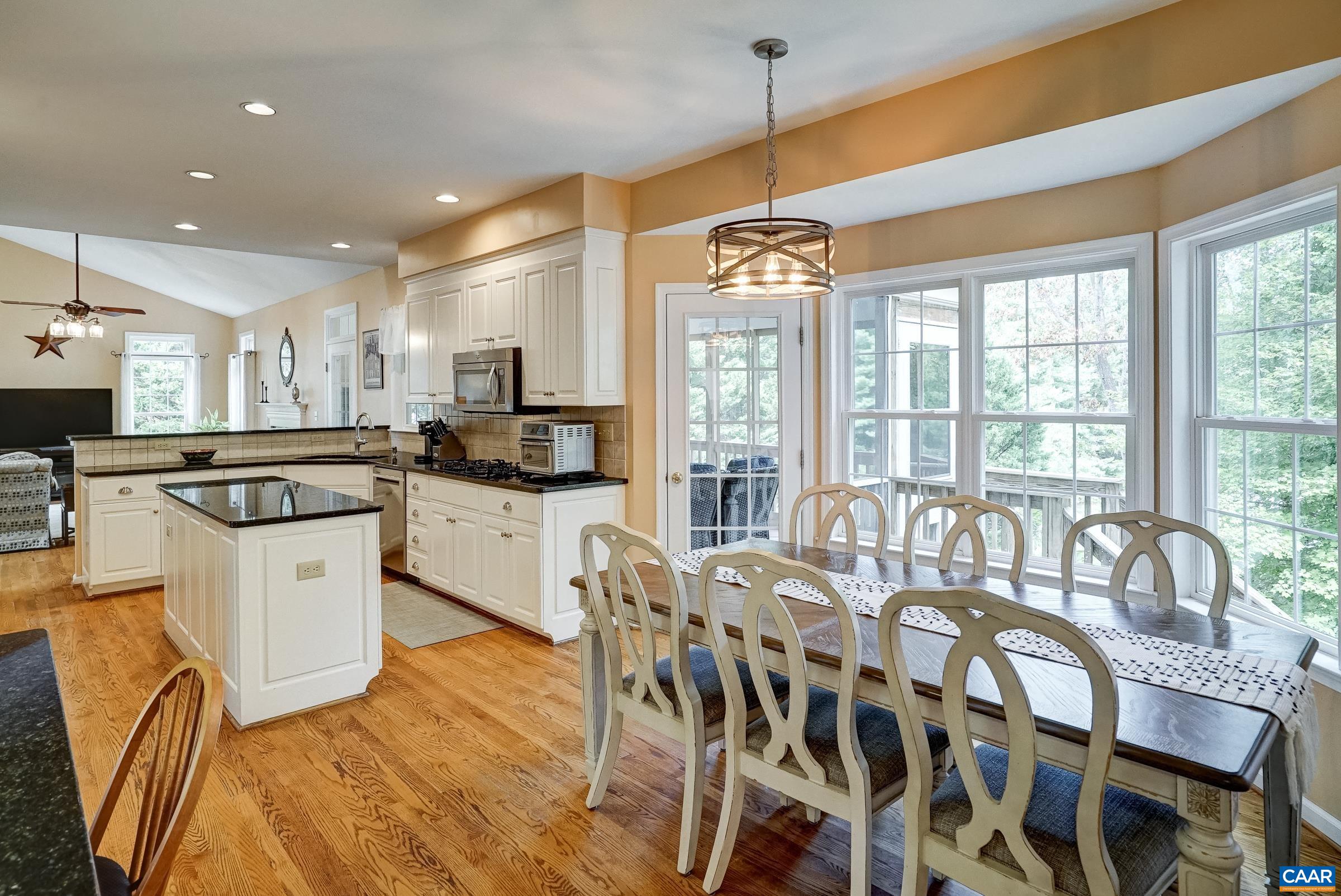 Light Filled Eat-In Dining area leading out to the Screened-in Porch Light Filled Eat-In Dining area leading out to the Screened-in Porch