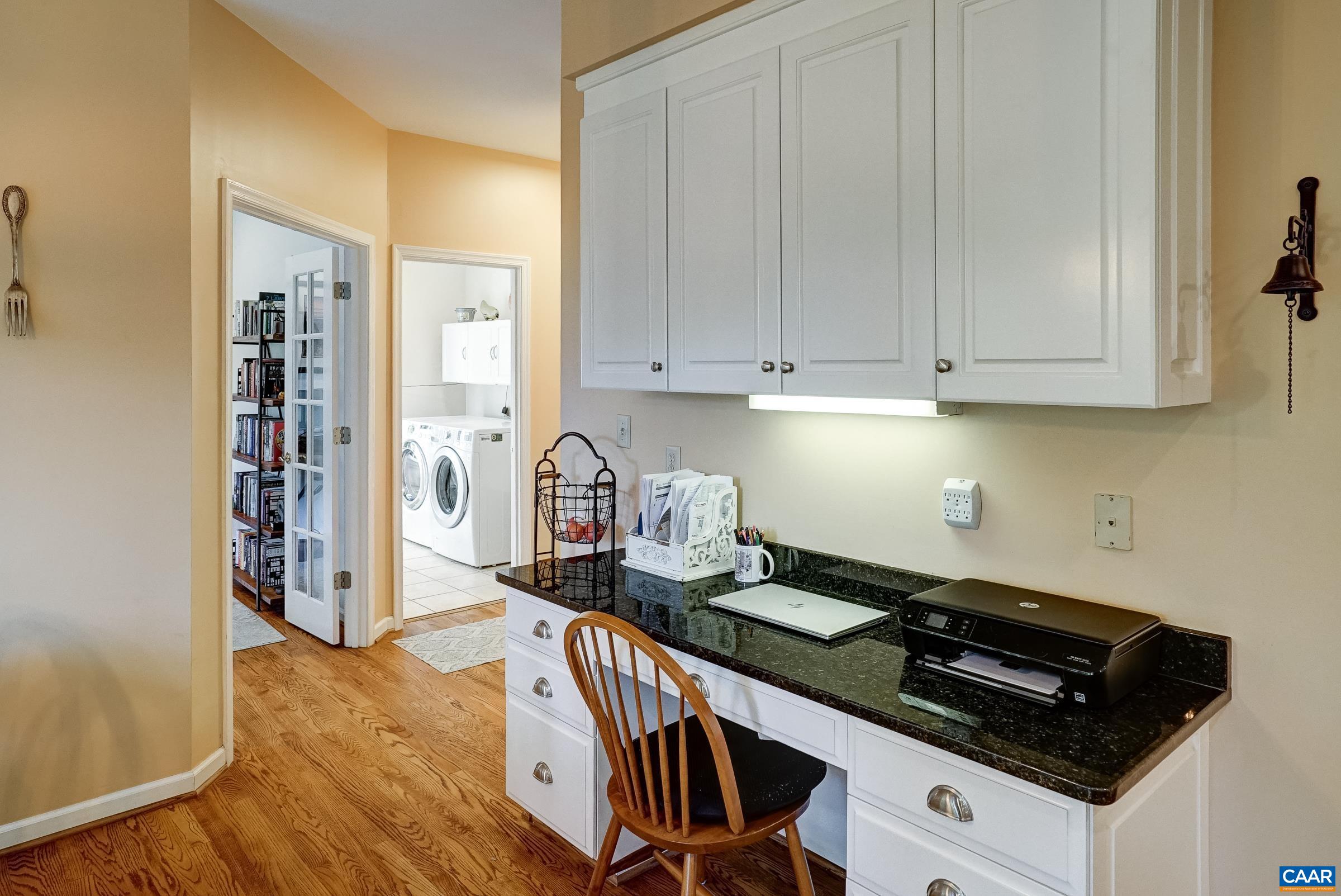 Desk area leading to the Office, Laundry Room and Garage. Desk area leading to the Office, Laundry Room and Garage.