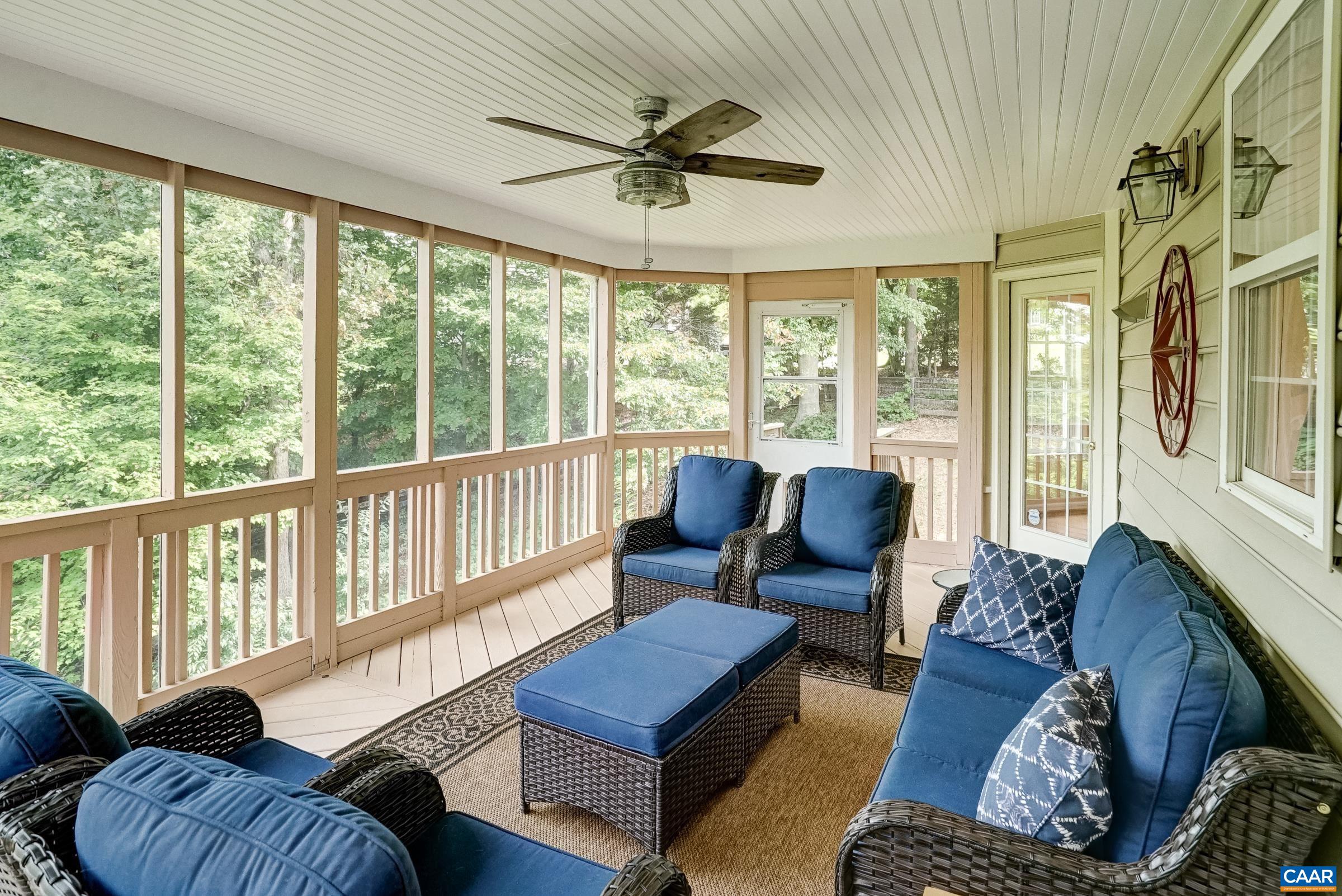 Screened-in porch with stairs to the backyard Screened-in porch with stairs to the backyard