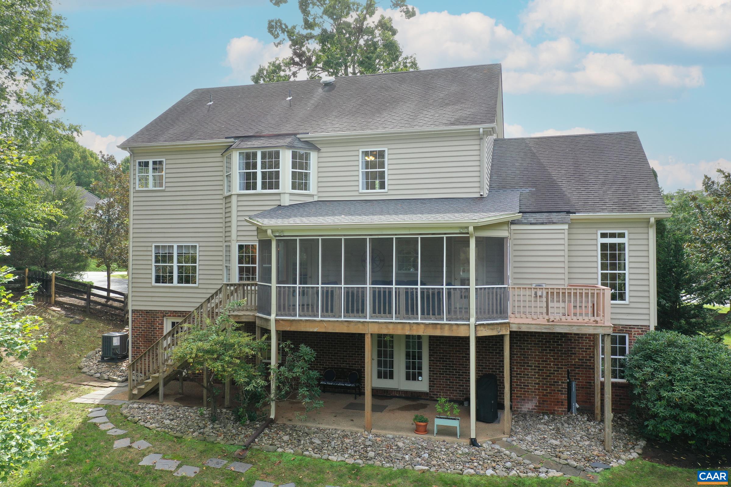 Screened in porch overlooking the beautiful fenced back yard Screened in porch overlooking the beautiful fenced back yard