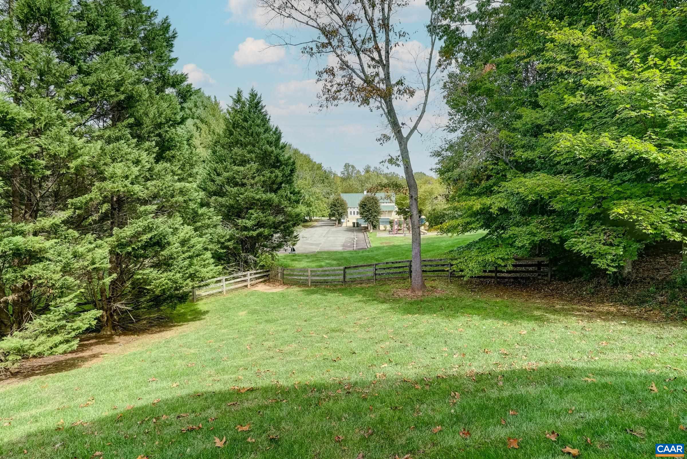 Fenced-in backyard with gate to the Swim and Tennis Club Fenced-in backyard with gate to the Swim and Tennis Club