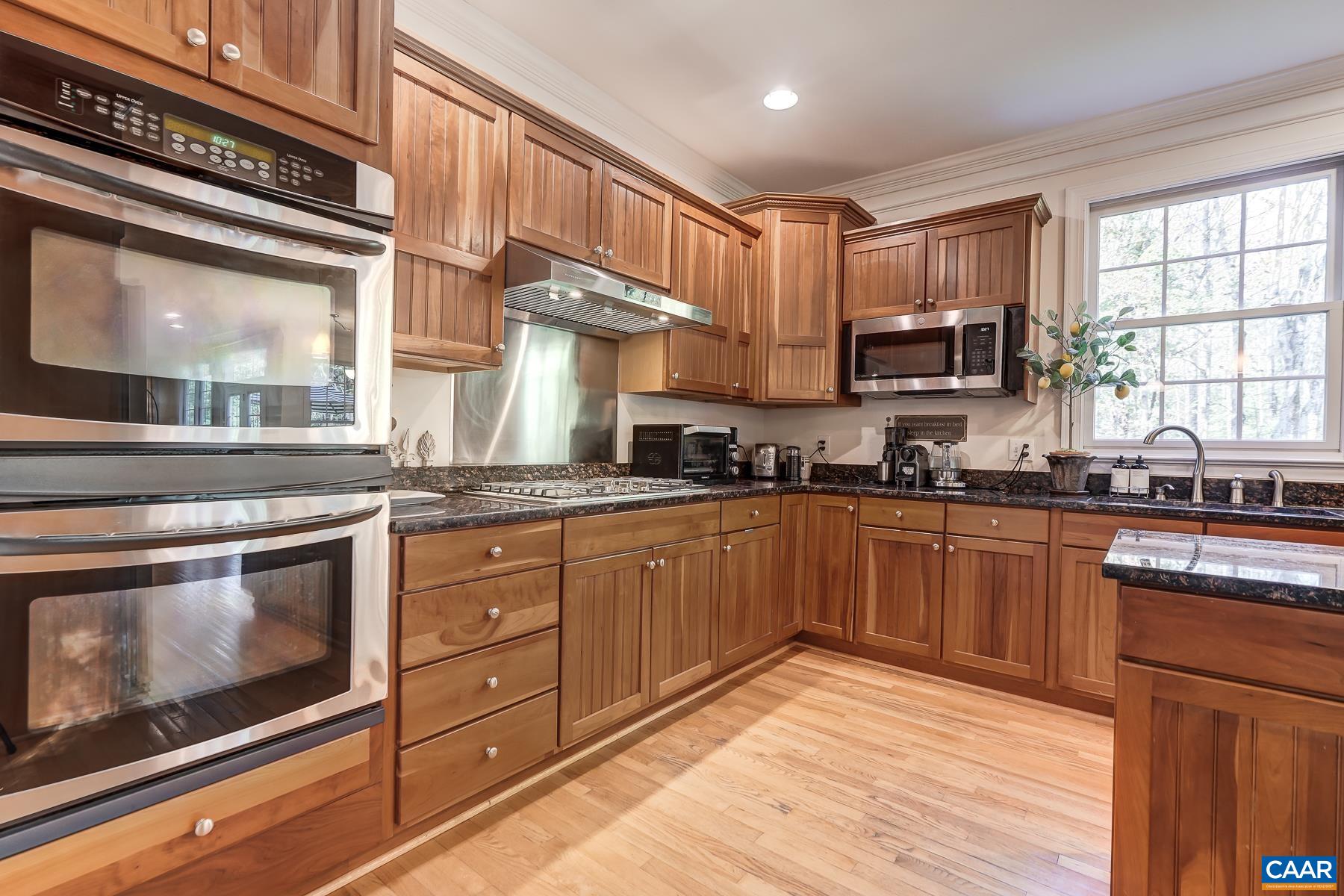 Gourmet kitchen features shaker cherry cabinets, and granite countertops. Gourmet kitchen features shaker cherry cabinets, and granite countertops.