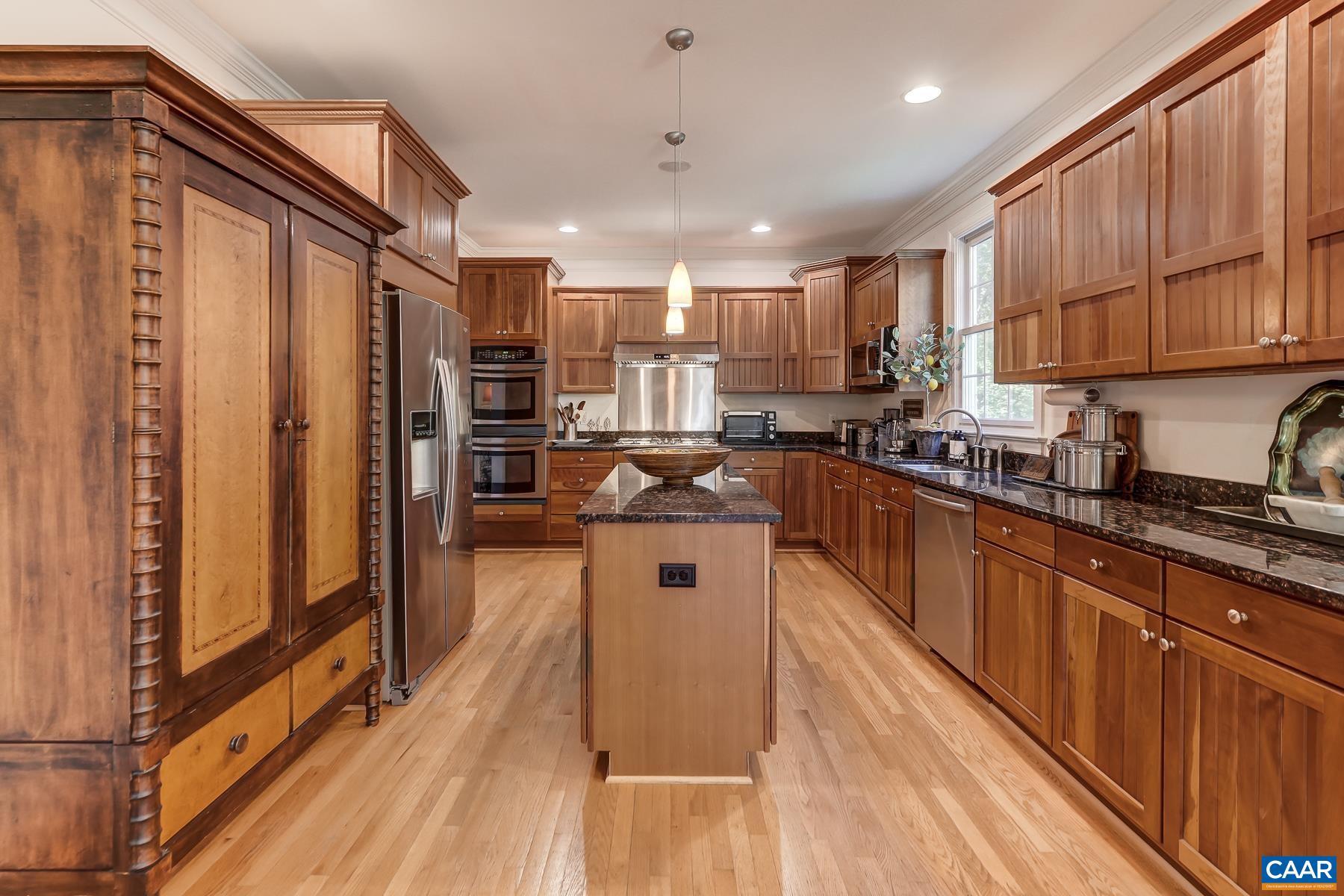 Stainless appliances include a new gas range and range hood. Stainless appliances include a new gas range and range hood.