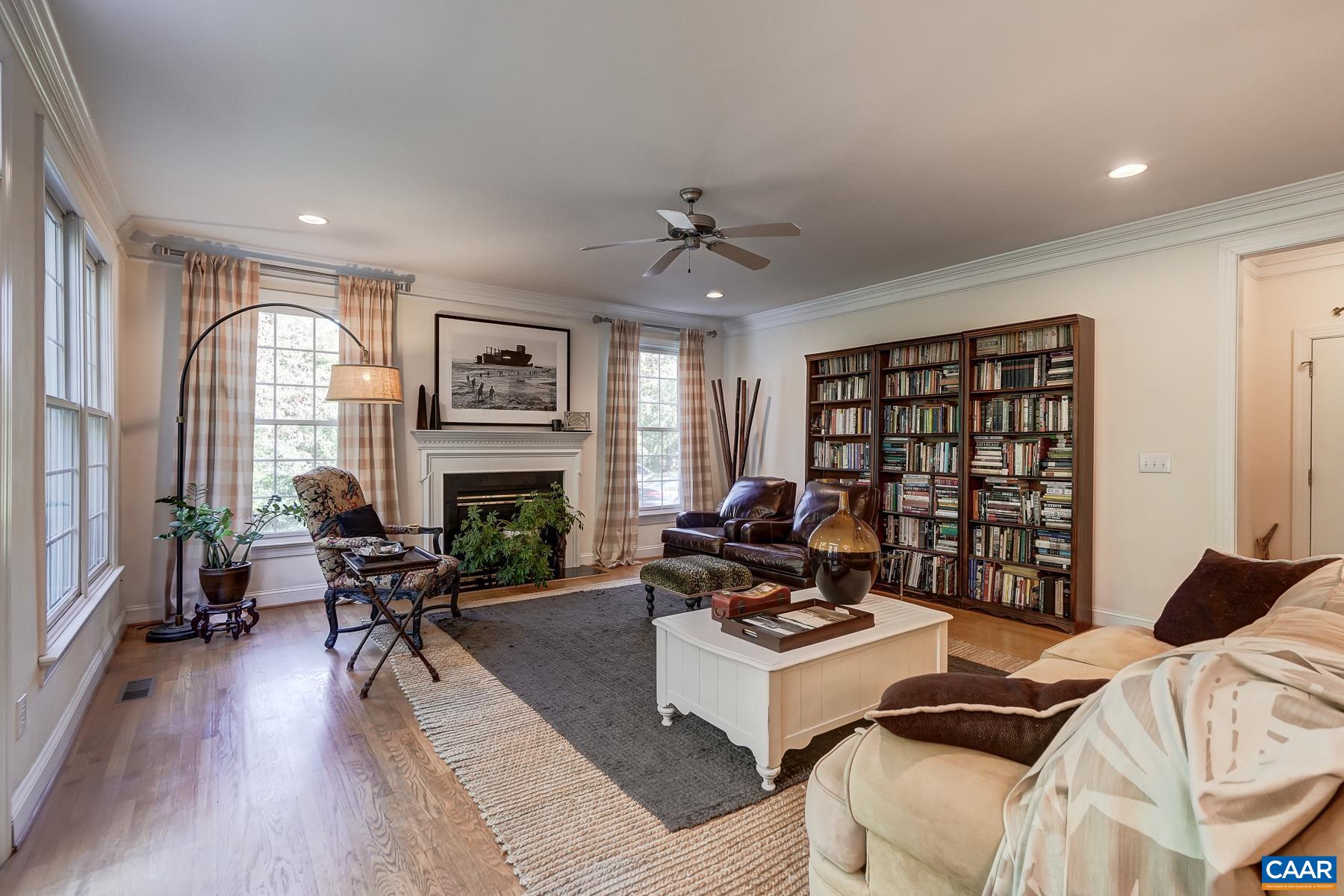 Great room with gas fireplace and ceiling fan. Great room with gas fireplace and ceiling fan.