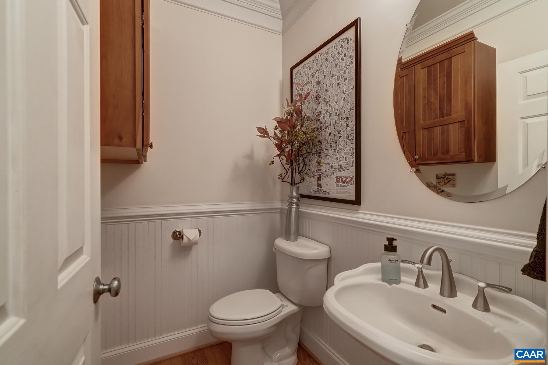 Large powder room with beadboard details. Large powder room with beadboard details.
