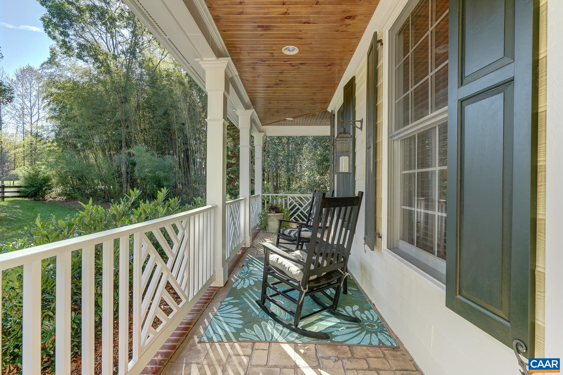 Wrap around covered front porch with beadboard ceiling Wrap around covered front porch with beadboard ceiling