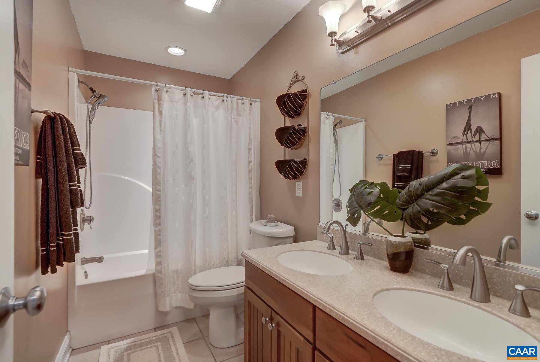 Full hall bathroom with double sinks. Full hall bathroom with double sinks.