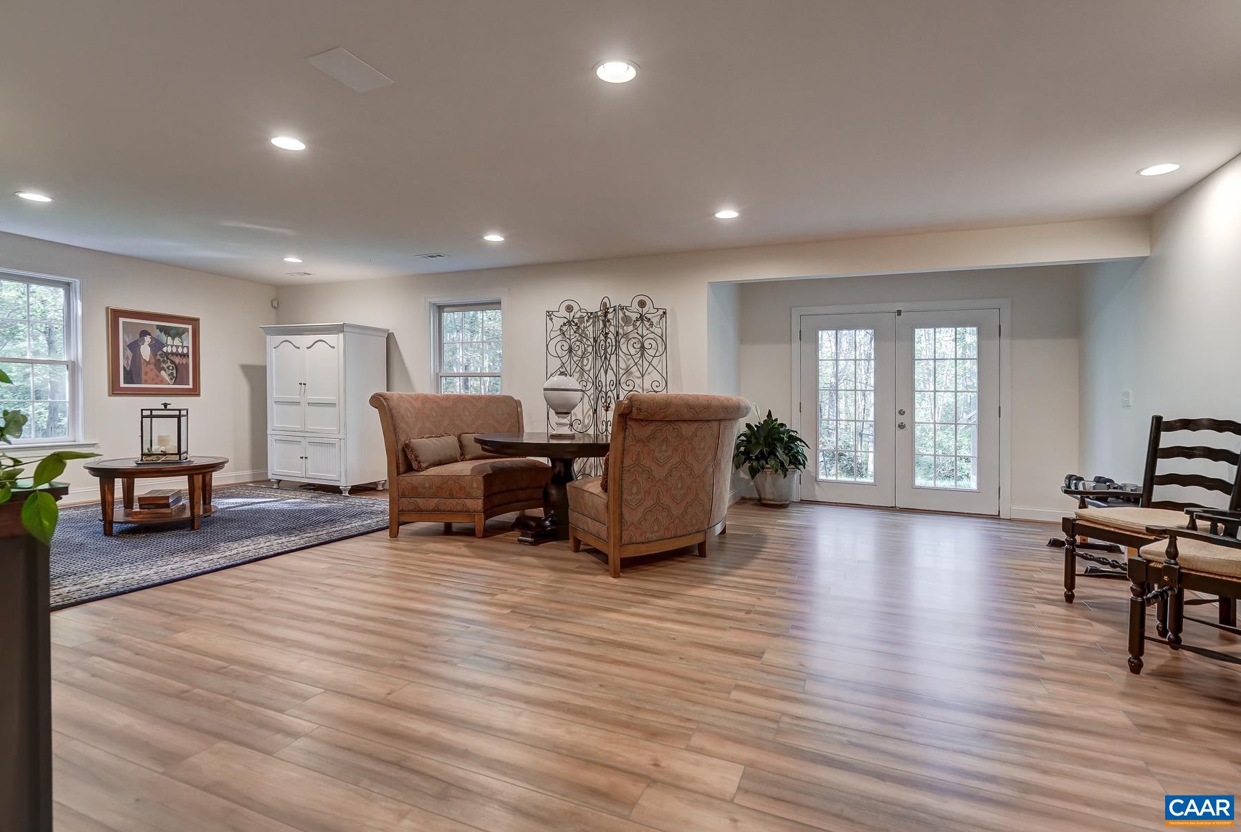 Newly finished walk-out basement features LVP flooring. Newly finished walk-out basement features LVP flooring.